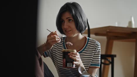 Tracking-video-of-woman-feeding-her-girlfriend-with-ice-cream.