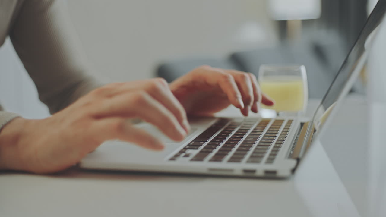 Person typing on a laptop