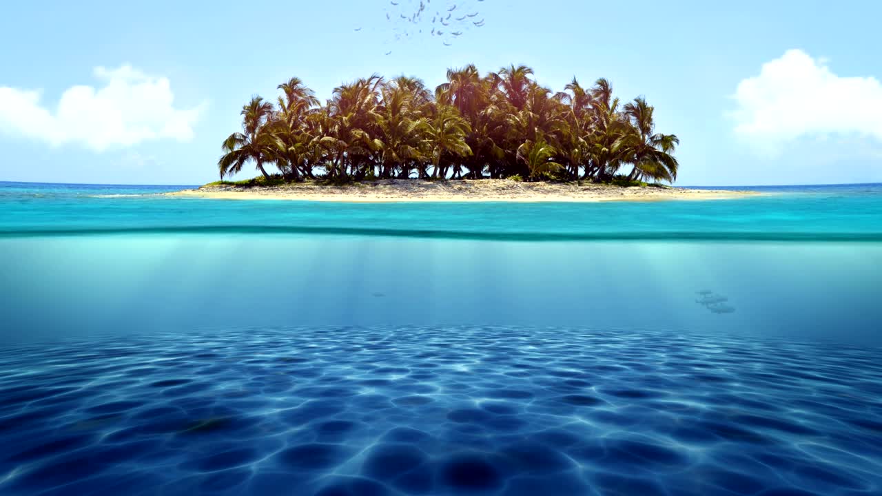 Half underwater view towards the tropical island on sunny day. Seamles loop animation.