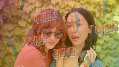 pride text and peace sign animation over two women posing outdoors