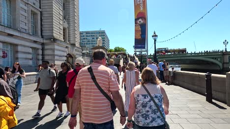 crowds enjoying a sunny day in london