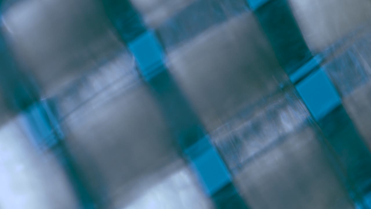 Fiberglass twill weaves under microscope