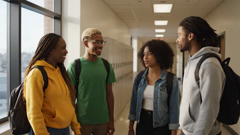 diverse students conversing in a school hallway