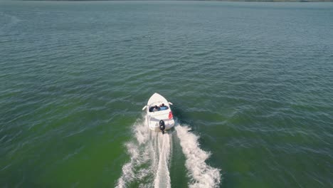 fast motorboat speeding through the coastal waters of isla de mujeres, mexico