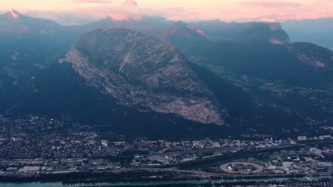 grenoble aerial panoramic of city and alps french mountain view during epic cloudy sunset