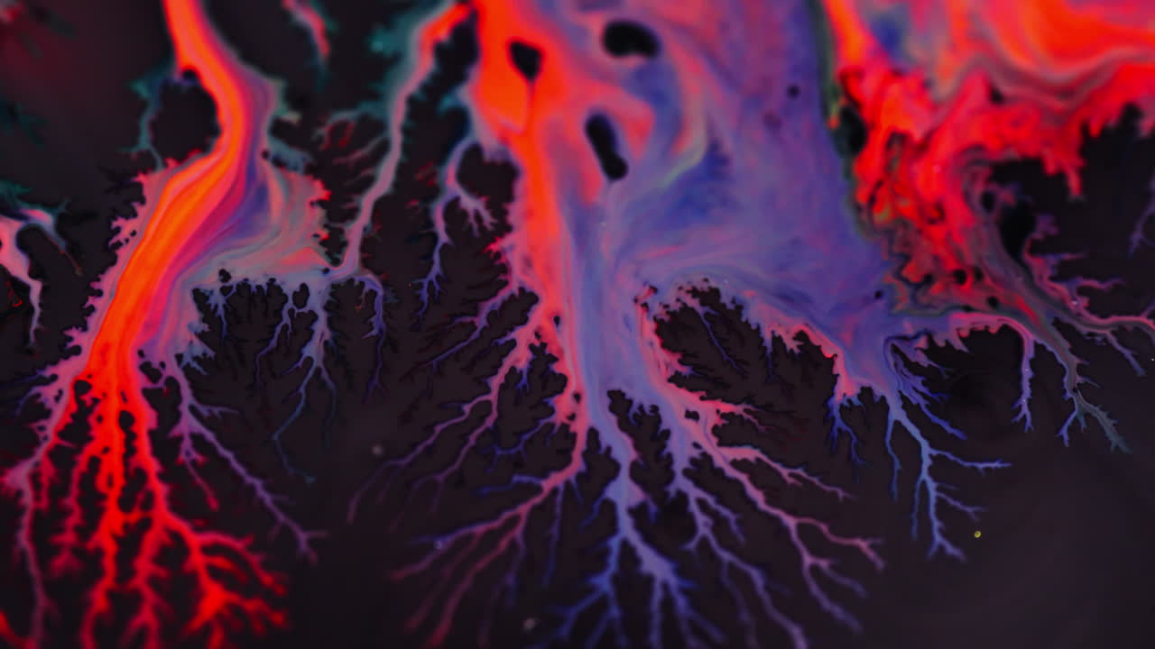 Vivid macro shot of colorful ink spreading like electric veins
