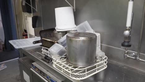 Dishes-by-a-restaurant-sink-before-remodelling