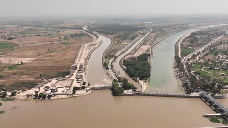 A-drone-shot-of-a-countryside-area-where-head-Panjnad-bridge-is-seen-along-with-its-surrounding