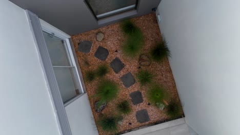 aerial descent over a landscaped garden courtyard