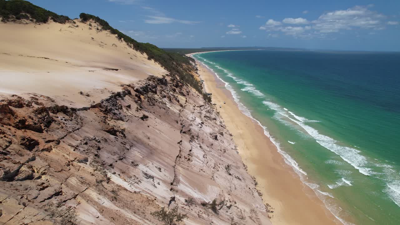 Drone Flyover Capturing Rainbow Beach’s Pristine Coast And Massive Dunes