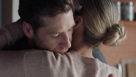 unhappy woman hugging boyfriend young couple having relationship trouble embracing emotional issues sharing bad news