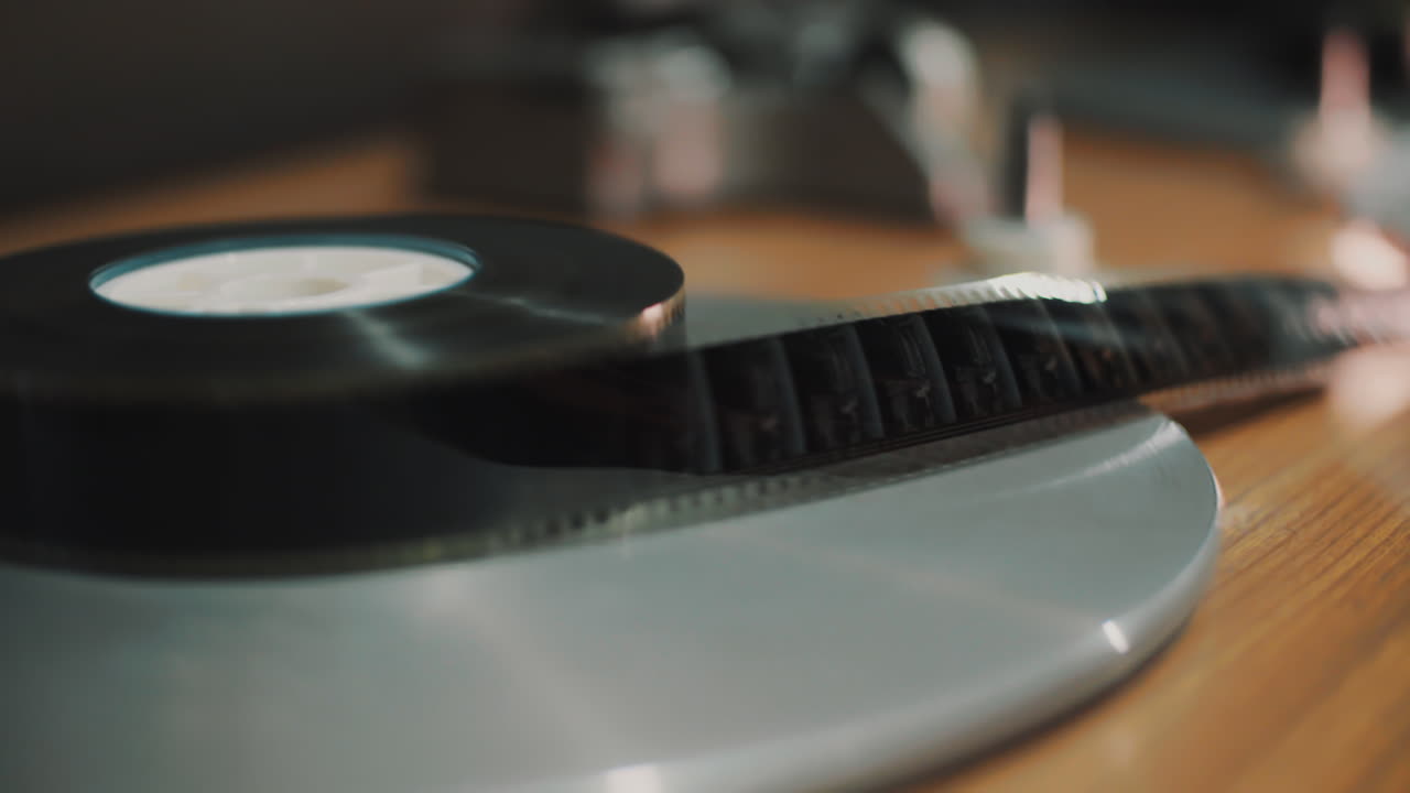 A film strip is wound on a roll
