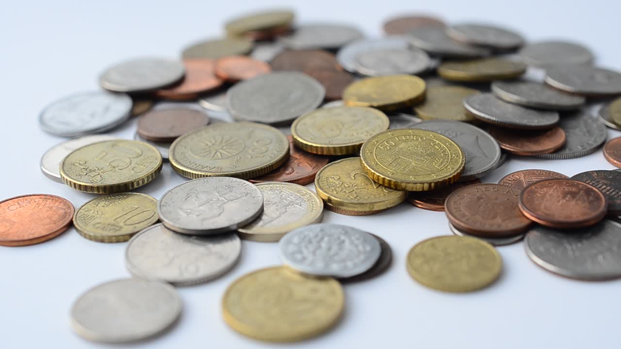 Coins of the different countries of the world. Coins on a white background