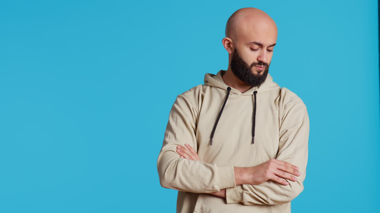 Middle eastern person acting impatient over background