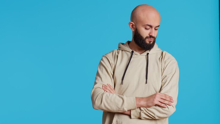 Middle eastern person acting impatient over background