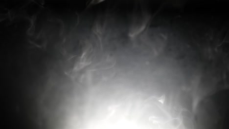 Slow-motion-tendrils-of-white-thin-smoke-spread-and-fall-in-lucid-dreamy-patterns