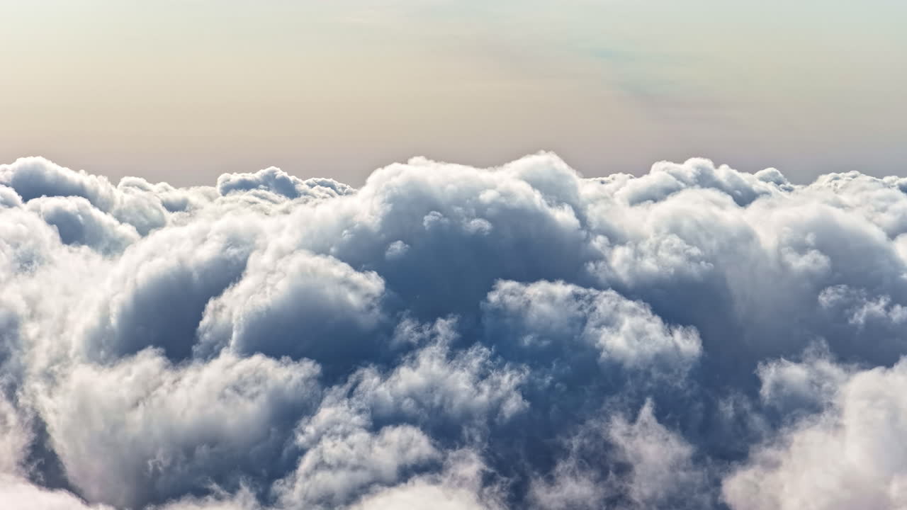 Fluffy cloudscape, aerial drone view flying high altitude