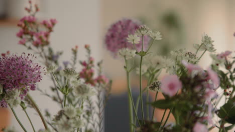 Rotating-Vase-With-fresh-Flowers,-Floral-Bouquet-On-The-Table-Inside-at-Home-Close-Up-4K