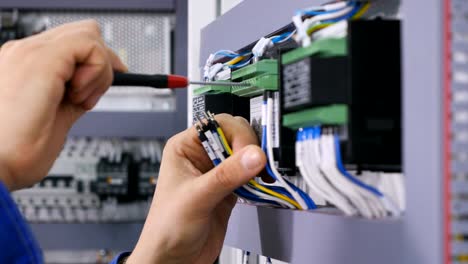 hands of person making a maintenance of the wires with the screw gun. 4k.