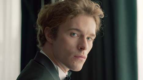 close-up portrait of a man in a tuxedo