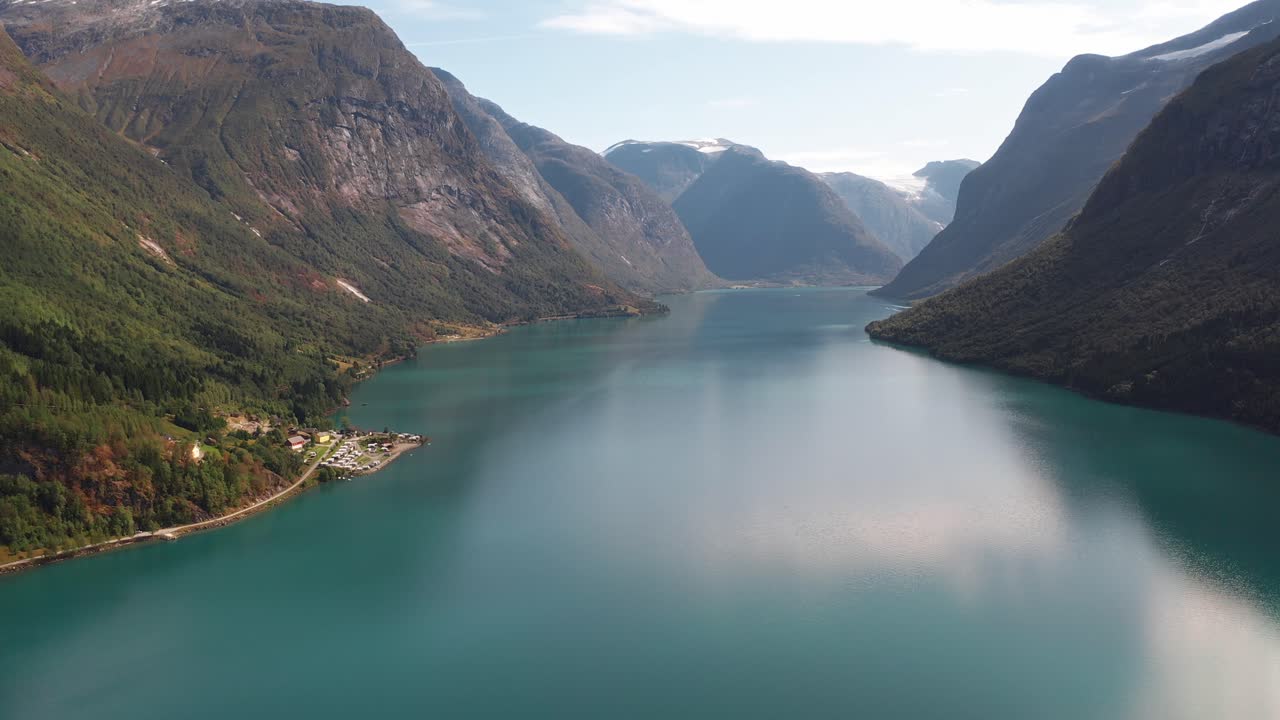Scenic view of Norwegian fjord with turquoise water and steep mountain cliffs
