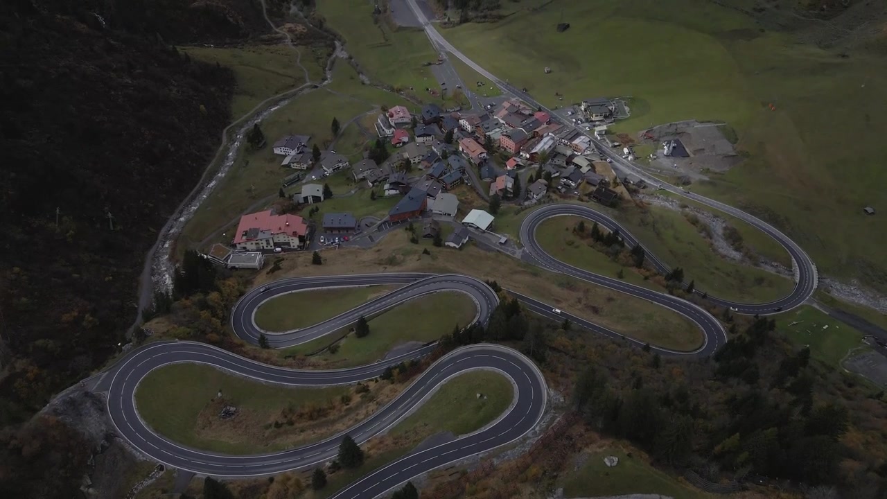 A picturesque view of winding roads near the serene village of Stuben, Austria. Surrounded by lush greenery and mountainous terrain, this tranquil alpine setting highlights natural beauty and charm