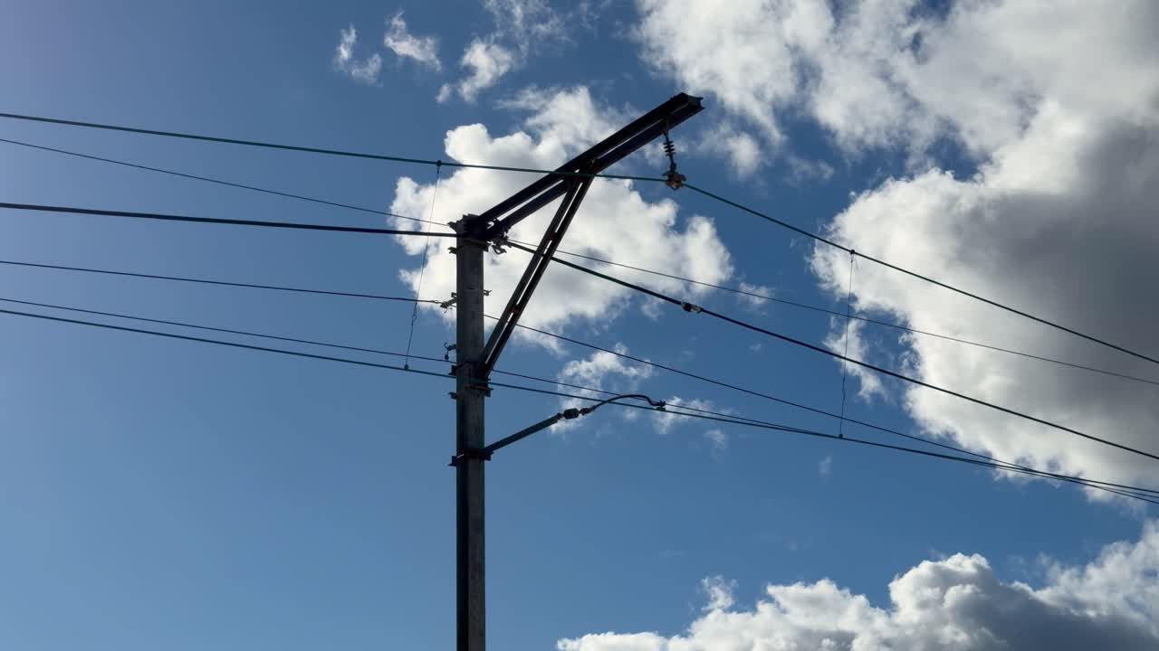 Train line overhead cables and pylons near Muizenberg, Cape Town