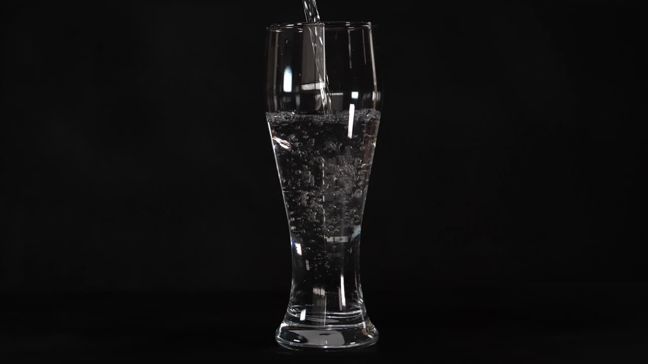 Ripple motion, clear transparent tumbler, water pouring, liquid hydration