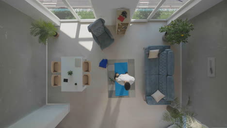 man keeping fit, exercising in room