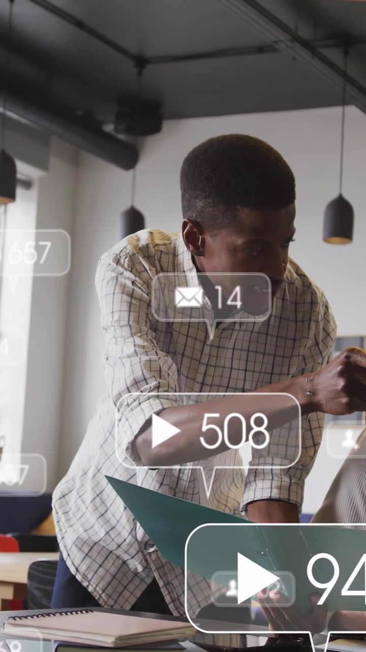 Vertical video: Man tapping phone, flipping green binder while animated UI updating for business