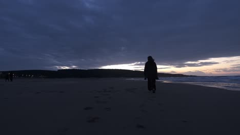 woman walking beach