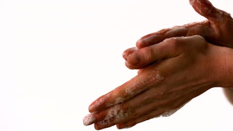 woman washing her hands with soap