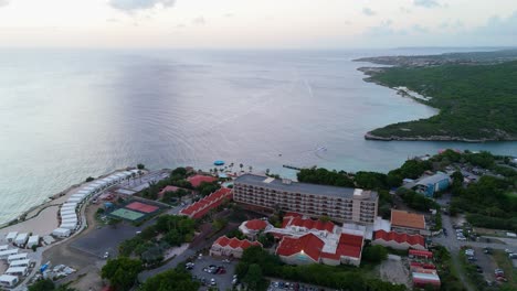 panoramic orbit rear view behind hotel on caribbean coast looking out to sea