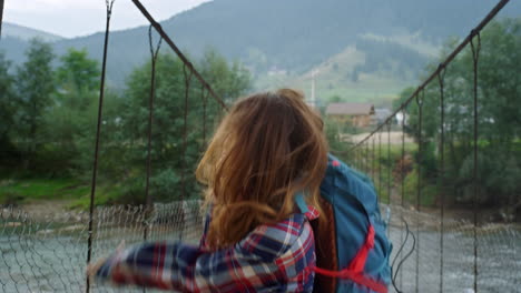 happy woman travel dance on mountain holiday. overjoyed hiker having fun outdoor