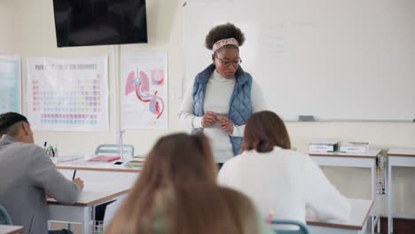 a teacher giving a lesson to students in a classroom