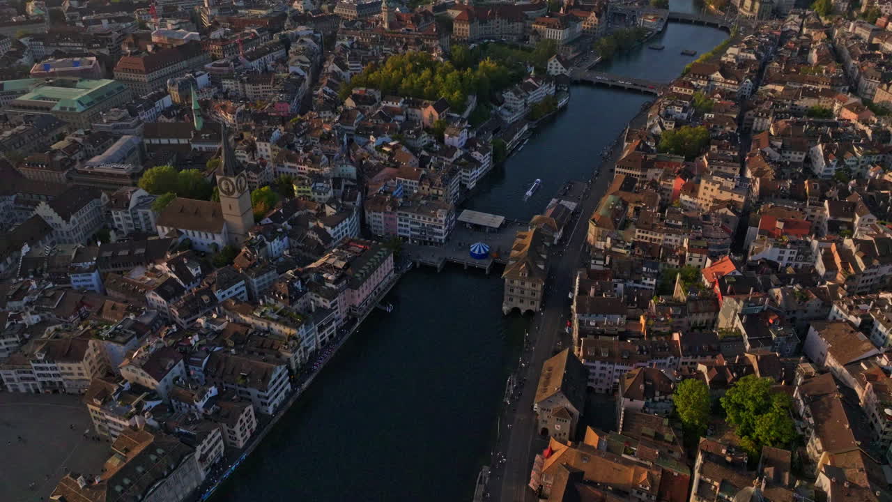 Golden summer sunset over Zürich, captured by drone with stunning views of the city, lake, river, and iconic churches.