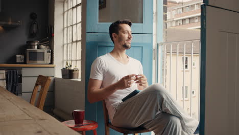 man shopping with credit card using digital tablet at home in pajamas