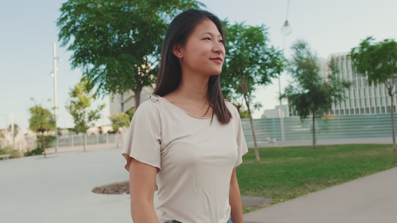 Asian woman in urban park