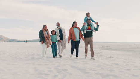 grandparents, parents and kids walking on beach