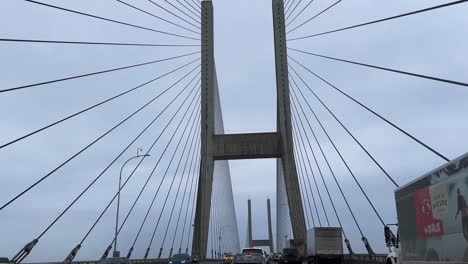 moving through the bottom of the alex fraser bridge delta in vancouver canada on a overcast cloudy day british columbia