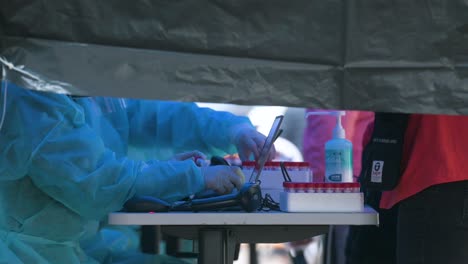 chinese residents go through a covid-19 coronavirus mass testing outside a public housing building placed under lockdown after a large number of residents tested positive