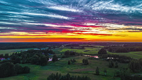 colorful sunset sky with clouds over rural landscape