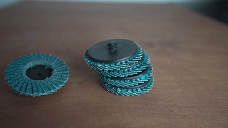 detail of a grinding wheels laid on the wooden table