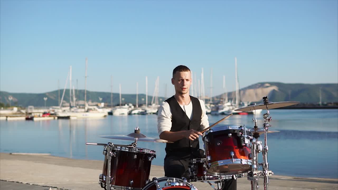 Drummer Playing Drums at Waterfront Marina