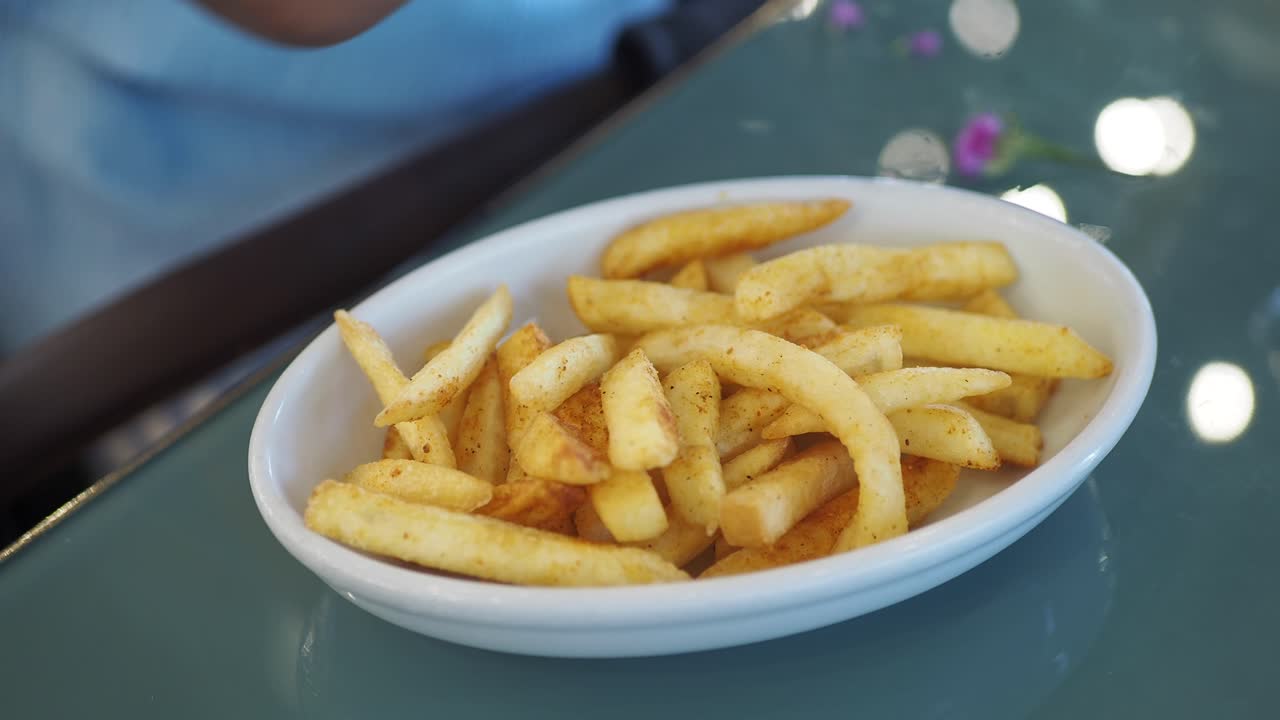 Person eating french fries