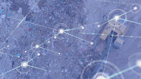 Network of connections over lorry in rubbish disposal site