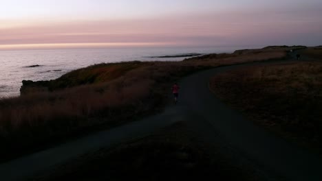 Silhouetted-male-jogger-notices-a-drone