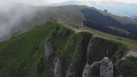 drone shot backward flying revealing a mountain ridge