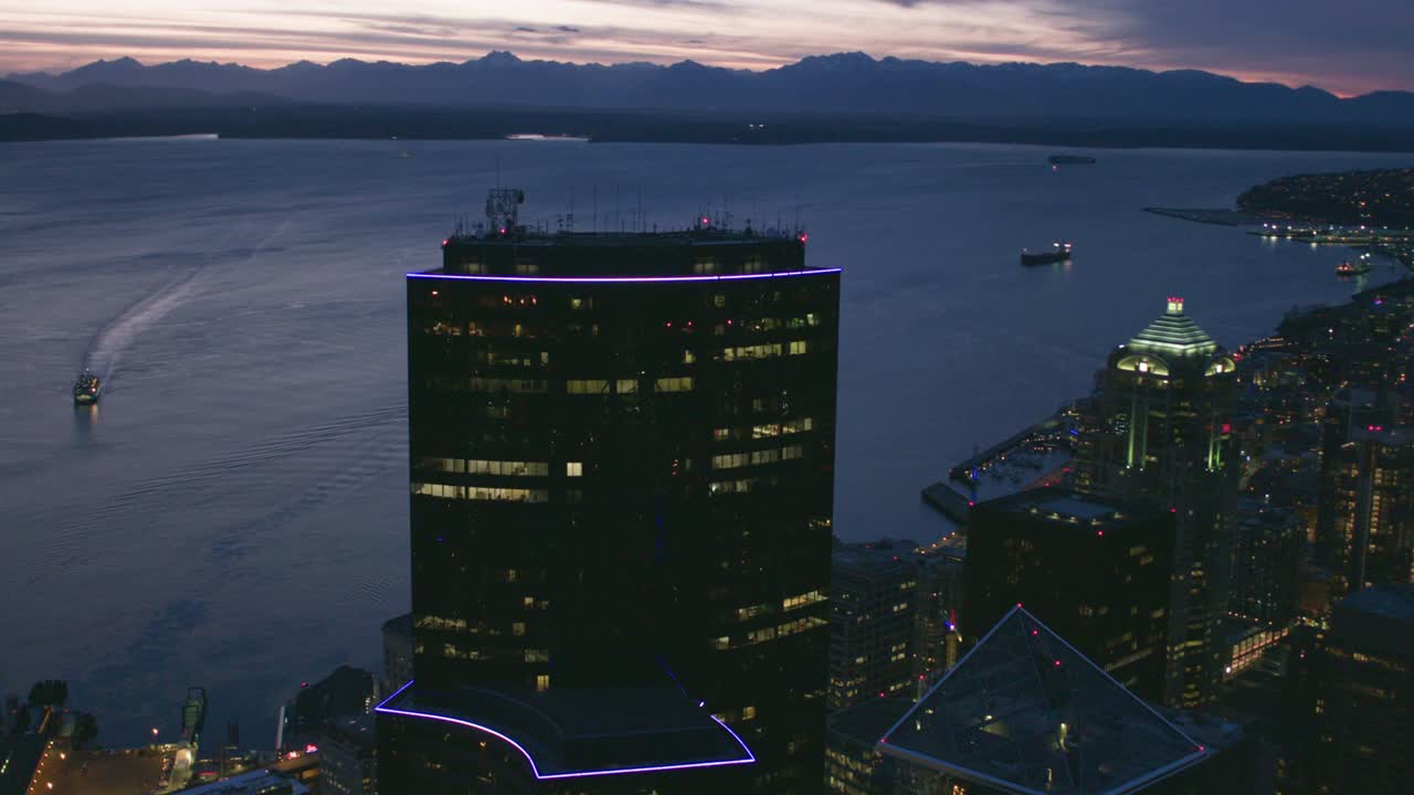 Cinematic Seattle Night Waterfront View Skyscraper Towers Ferry Ships Puget Sound Purple Sun Reflection Olympic Mountain Peaks Horizon