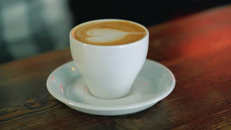 serve a cup of coffee. latte art coffee